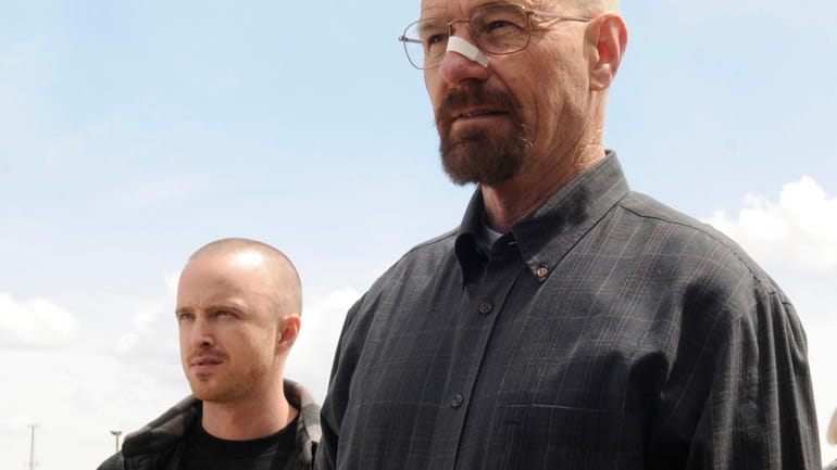 Bryan Cranston as Walter White, right, and Aaron Paul as...