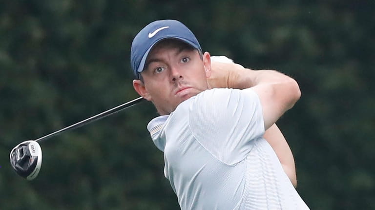 Rory McIlroy of Northern Ireland hits his tee shot on...