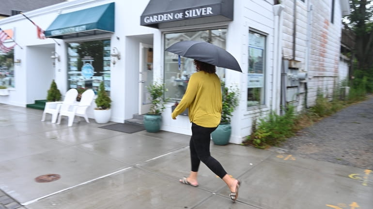 Scene on Main Street in Westhampton Beach during rainy Monday.