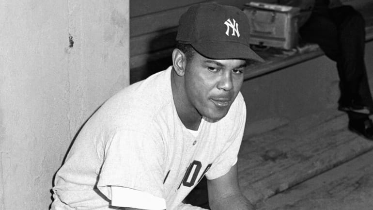 Yankees infielder Hector Lopez sits on the dugout wall prior...