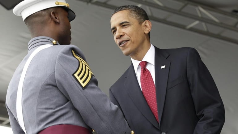 President Barack Obama congratulates Class President Arron Conley at the...