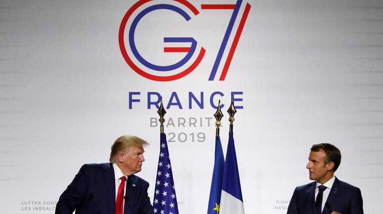 French President Emmanuel Macron and President Donald Trump attend the...