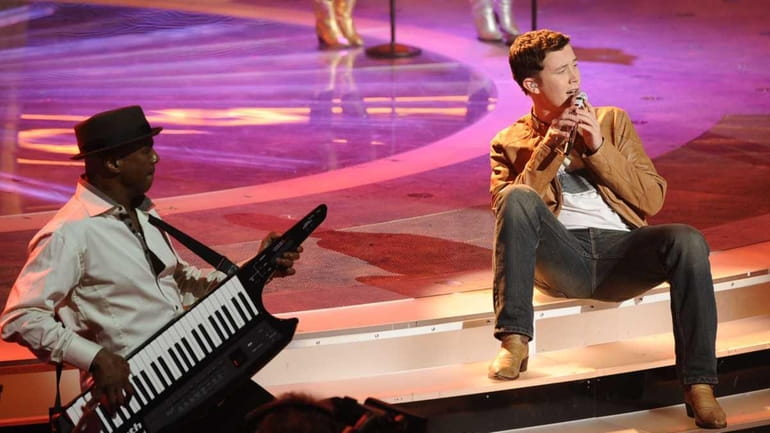 Scotty McCreery performs "Swingin" in front of the judges on...