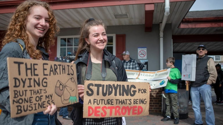 Zoe Scrivener and Allison Petrozzo, both of Huntington, stand with...