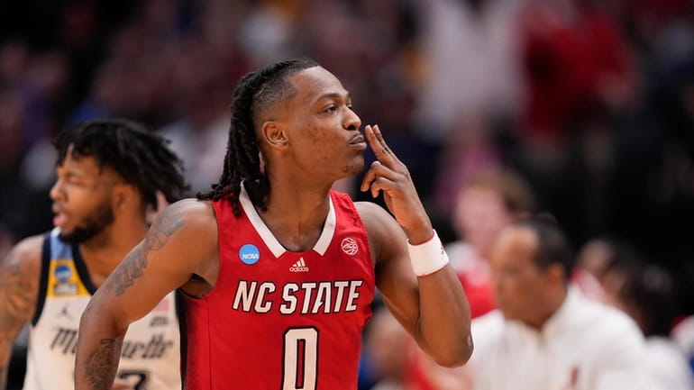 North Carolina State's DJ Horne reacts after scoring a basket...