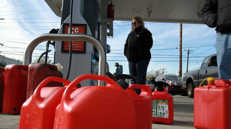 Woman waits for her can to fill up as long...