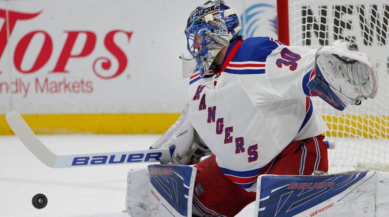 New York Rangers goalie Henrik Lundqvist makes a pad save...