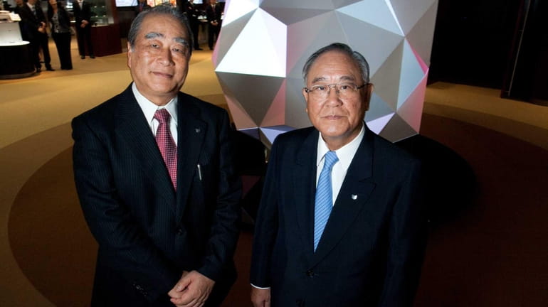 From left, Joe Adachi, president and chief executive of Canon...