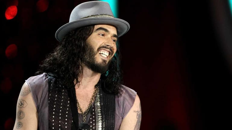 Russell Brand appears onstage at the MTV Movie Awards in...