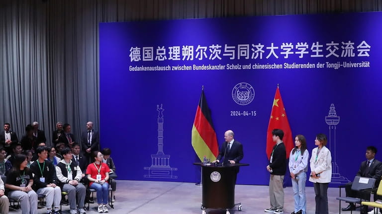 In this photo released by Xinhua News Agency, German Chancellor...