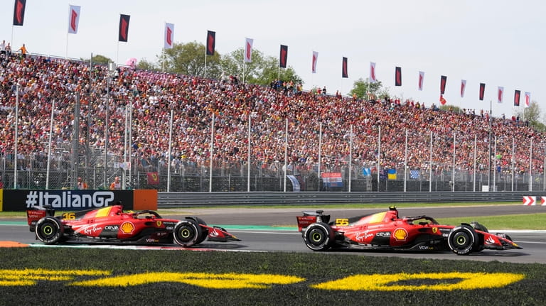 Ferrari driver Charles Leclerc of Monaco, left, and Ferrari driver...