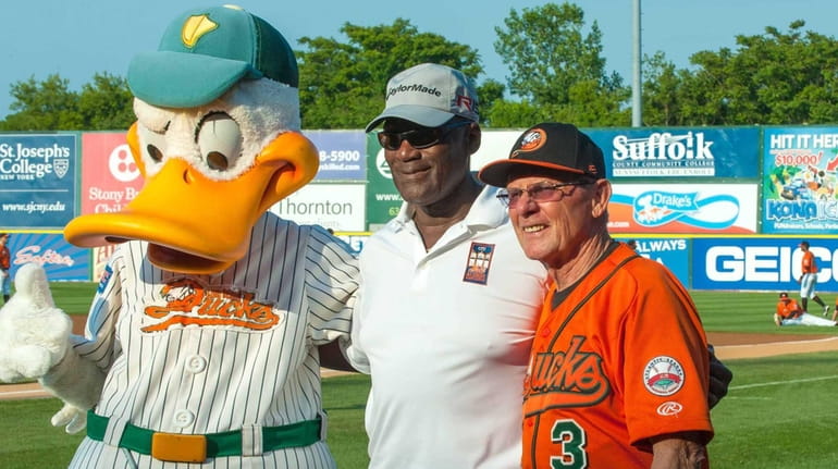George Foster, center, poses with Quacker Jack and Bud Harrelson...