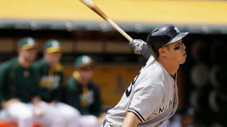 New York Yankees' Rob Refsnyder hits two-run double to right-center...