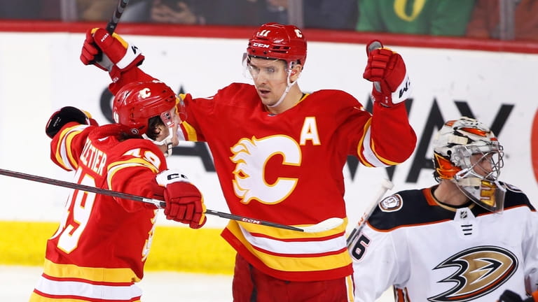 Calgary Flames' Mikael Backlund, center, celebrates his goal against Anaheim...