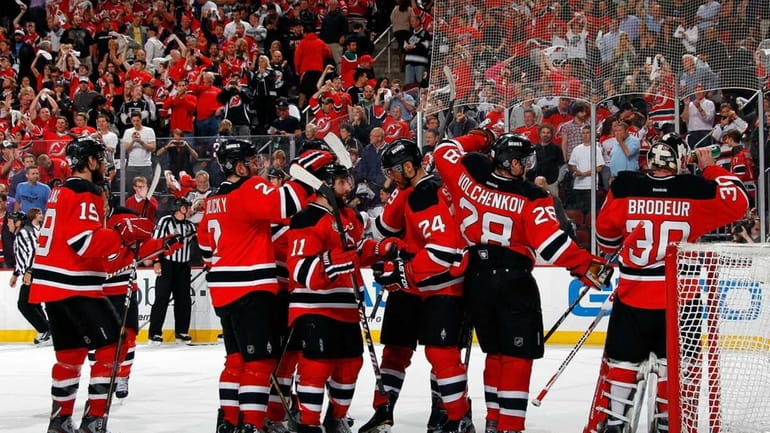The New Jersey Devils celebrate after defeating the Los Angeles...