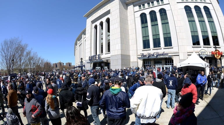 Yankee fans arrive for the opening day game against the...