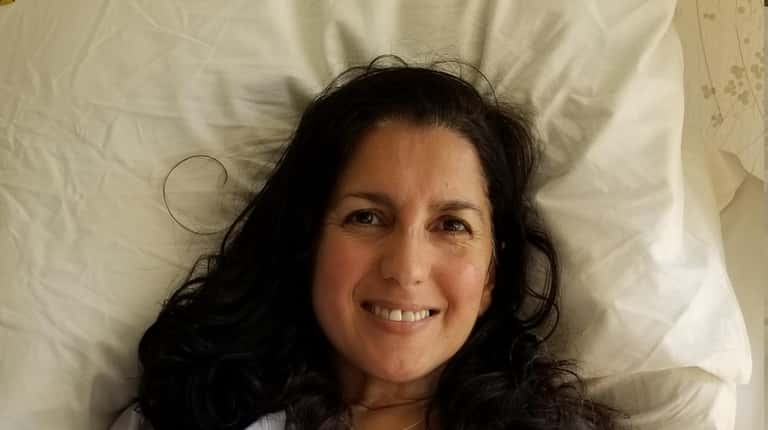 A smiling Lisa Calla of Smithtown post surgery at NewYork-Presbyterian/Columbia...