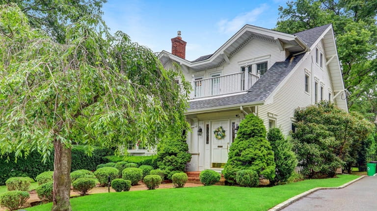 Priced at $1.699 million, this five-bedroom, 3½-bath traditional Colonial on Wellington...