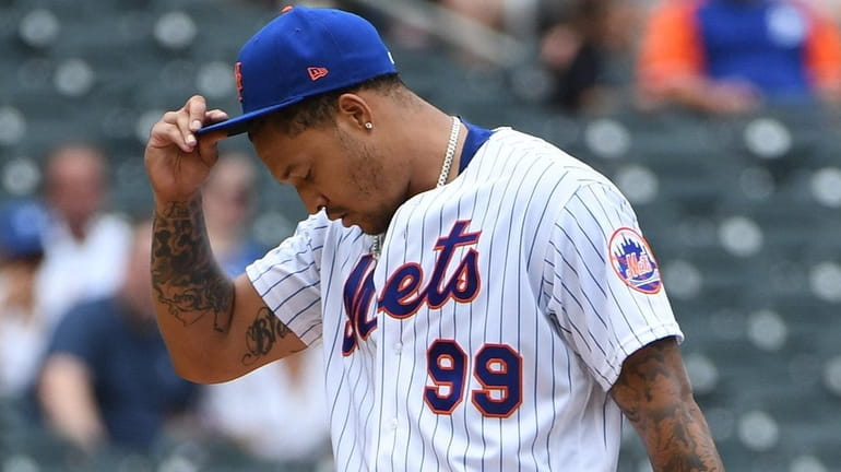 New York Mets starting pitcher Taijuan Walker reacts on the...