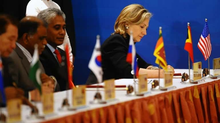 U.S. State Secretary Hillary Clinton signs a Treaty of Amity...