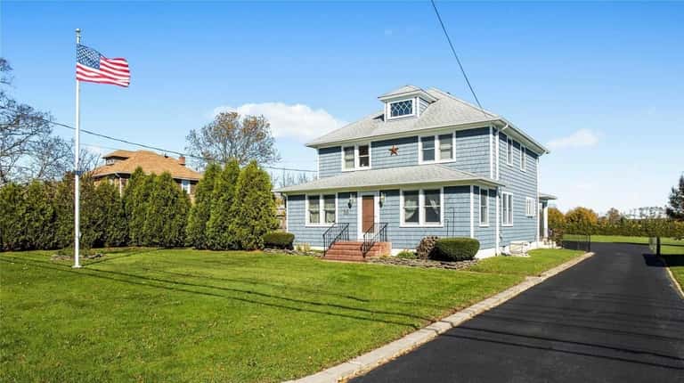 This Cutchogue farmhouse, for $699,000, includes four bedrooms and two...