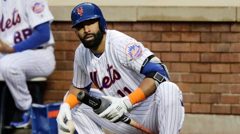 The Mets' Jose Bautista stretches while on deck during the...