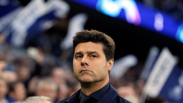 FILE - Manager Mauricio Pochettino looks out prior the Champions...