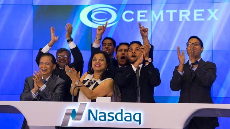 Saagar Govil, right, CEO of Cemtrex, celebrates with his executive...