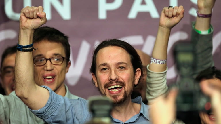 Far-left United We Can party leader Pablo Iglesias celebrates before...