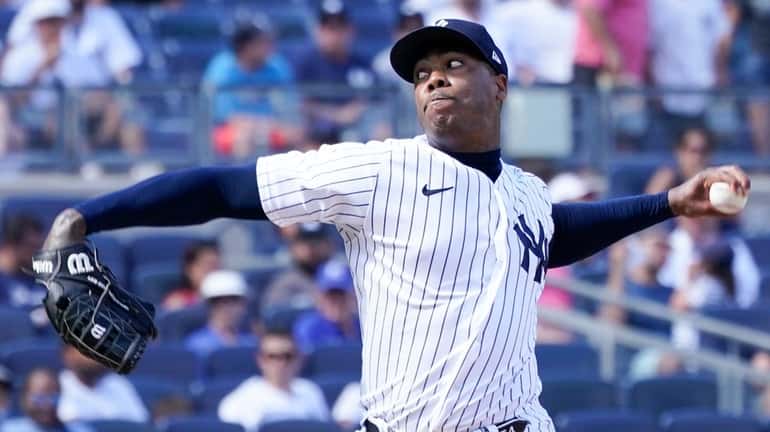 Yankees pitcher Aroldis Chapman delivers against the Royals during the...