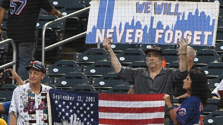Fans remembering 9/11 before a game between the Mets and...