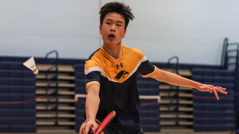 Jericho's Howard Zheng returns the volley during the Nassau boys...