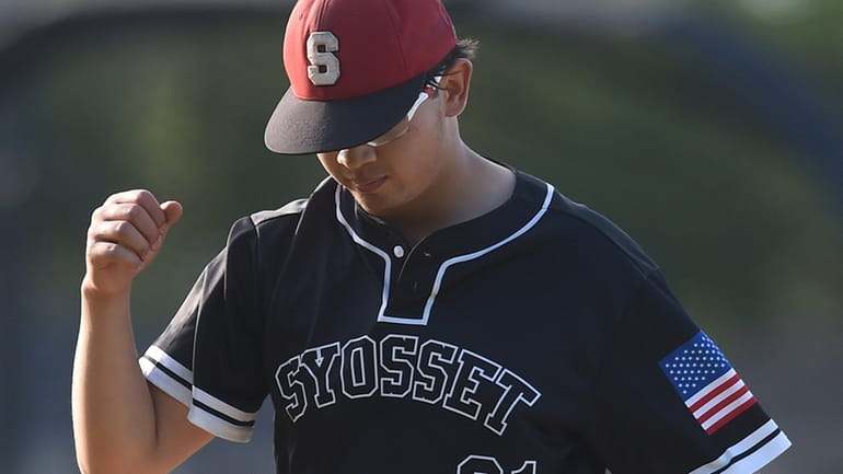 Alex Larson #21, Syosset pitcher, reacts after his team's 8-3...