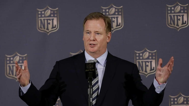 NFL commissioner Roger Goodell speaks to reporters during the NFL's...