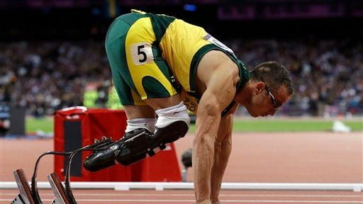 South Africa's Oscar Pistorius prepares to run in his men's...