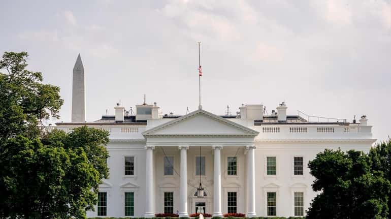 The American flag files at half-staff at the White House...