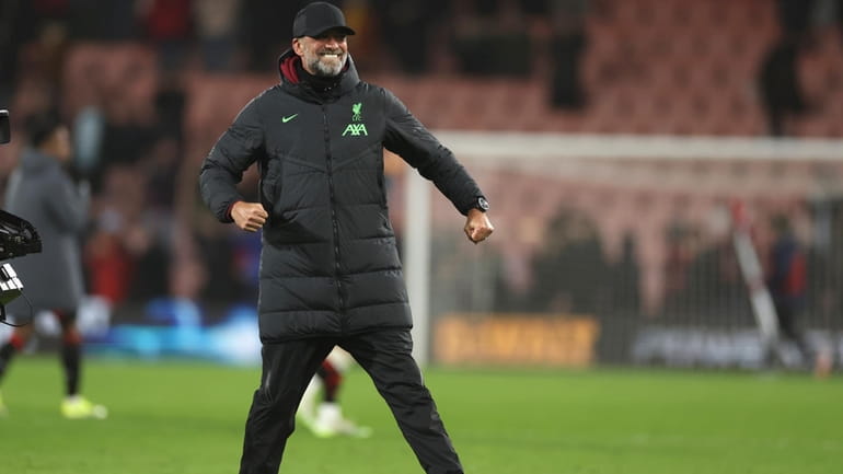 Liverpool's manager Jurgen Klopp celebrates at the end of the...