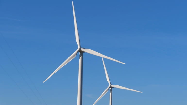 Land-based wind turbines spin in Atlantic City N.J. on Nov....