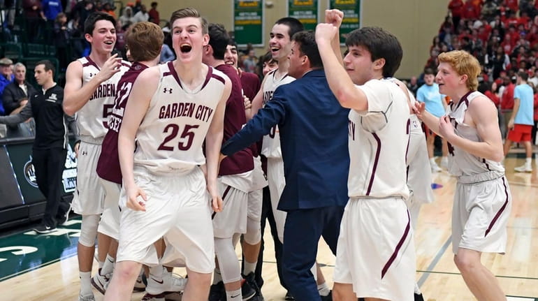 Garden City celebrates its victory over Floral Park in the...