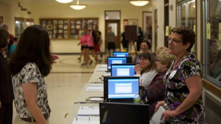 Voters at Bay Shore High School on May 17, 2011,...