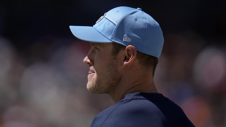 Tennessee Titans quarterback Ryan Tannehill watches from the sidelines during...
