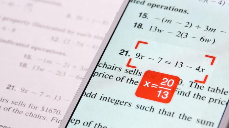 PhotoMath app's step-by-step solutions can help a student learn, while...