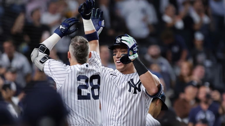 New York Yankees' Aaron Judge celebrates with Josh Donaldson (28)...