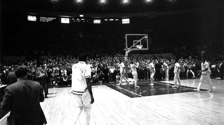 Willis Reed makes a dramatic entrance onto the court prior...