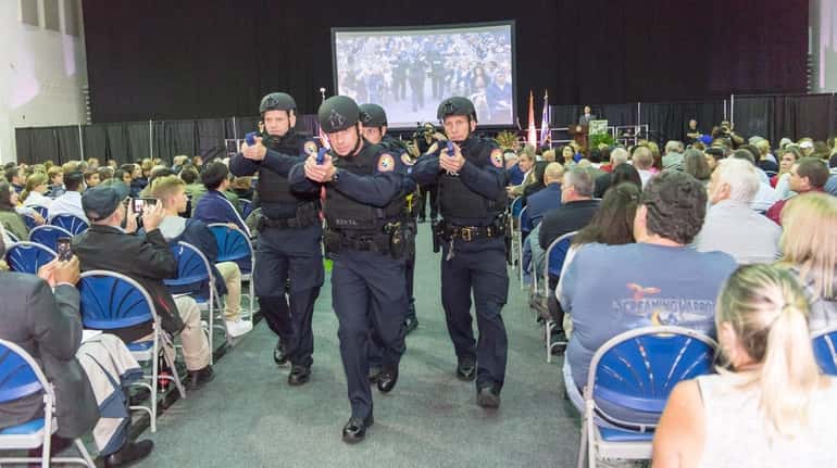Members of the NCPD Special Operations Unit display a diamond...
