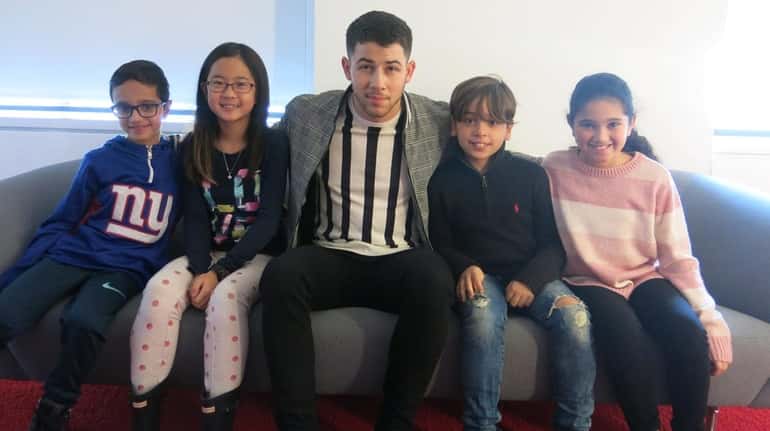 Singer and actor Nick Jonas with Kidsday reporters, from left,...