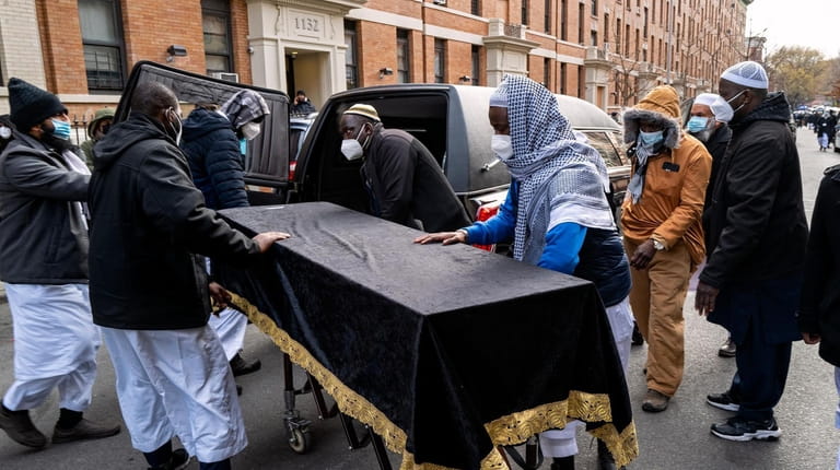 The coffin for one of the 15 victims who died in...