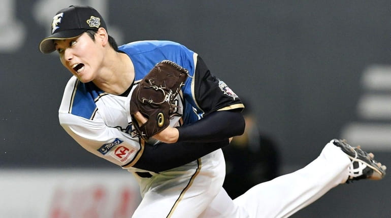 Shohei Ohtani of the Nippon Ham Fighters delivers at Sapporo...