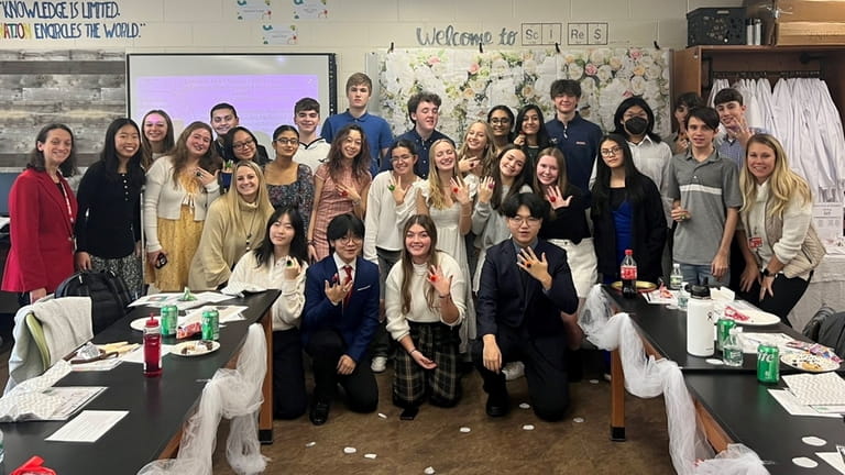 AP Research students at Mineola High School celebrated their year-long...