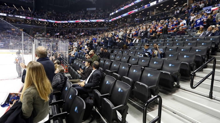 Empty seats are seen during the game between the New...